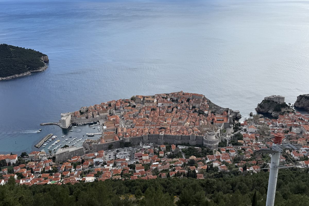 Dubrovnik’s walled Old Town and harbor on the Adriatic, seen from Mount Srđ, with Lokrum Island offshore