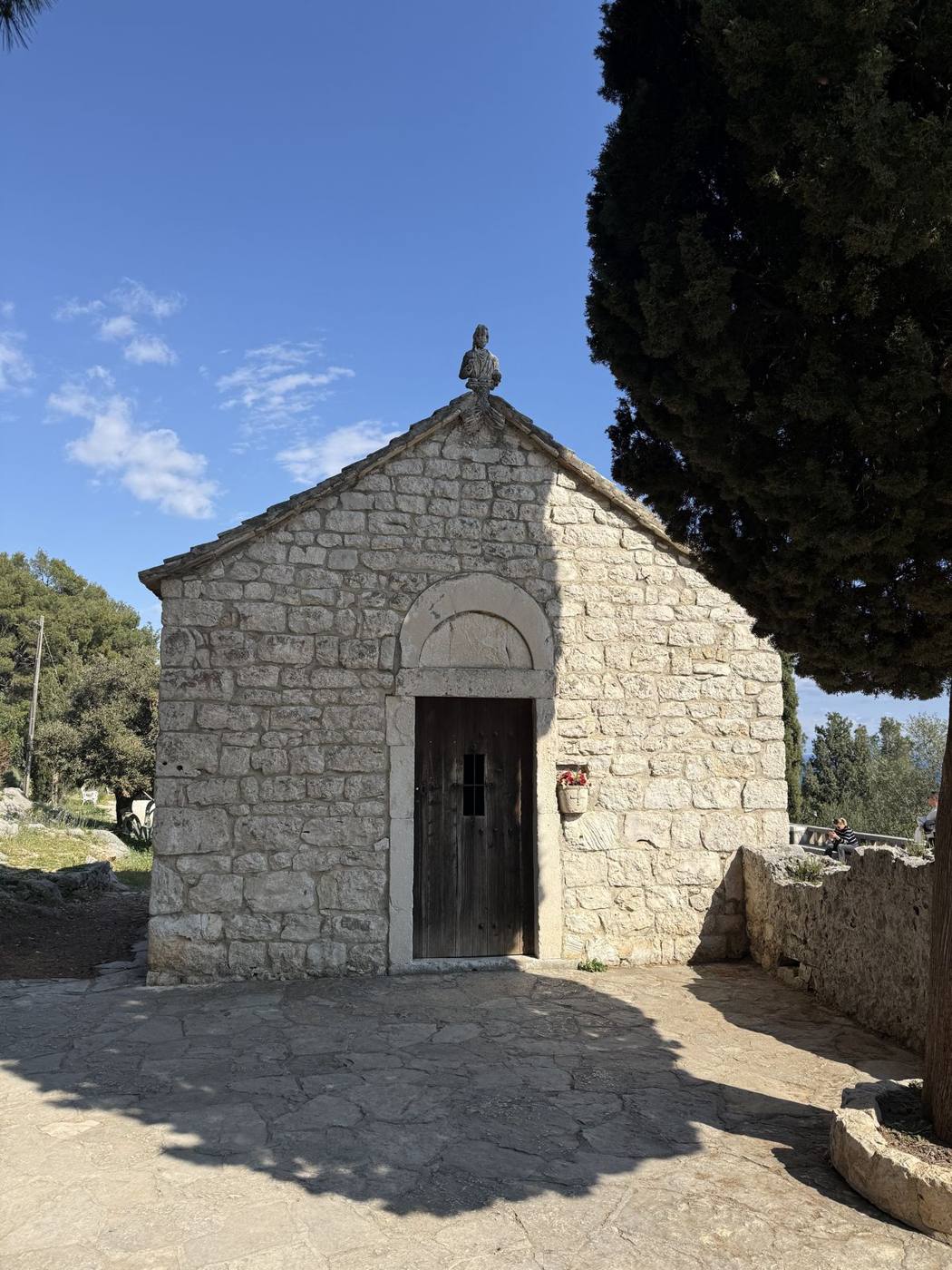 The small stone Church of St. Nicholas among pines on Marjan Hill in Split