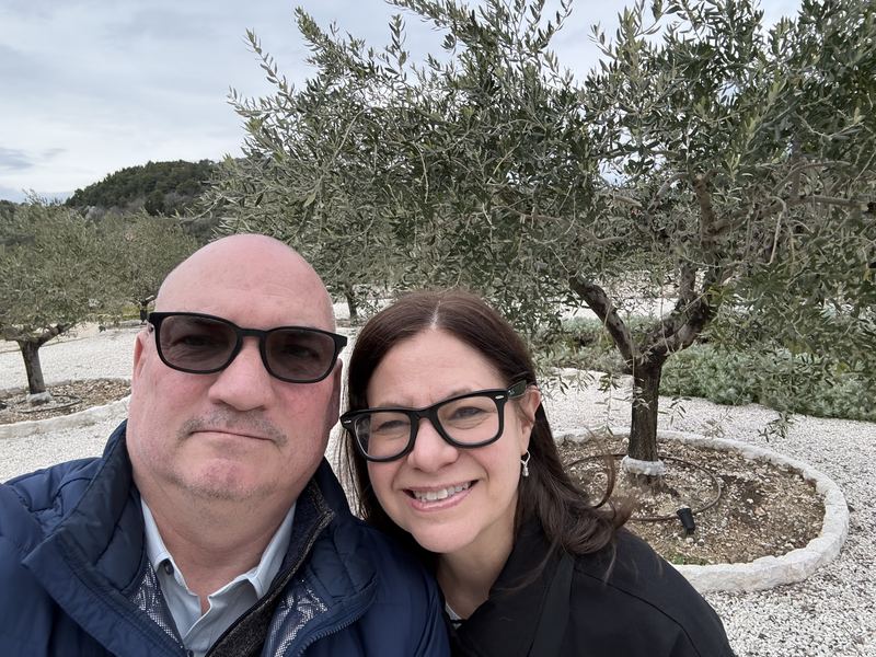 Troy and Mikki among the olive trees at Rizman Winery