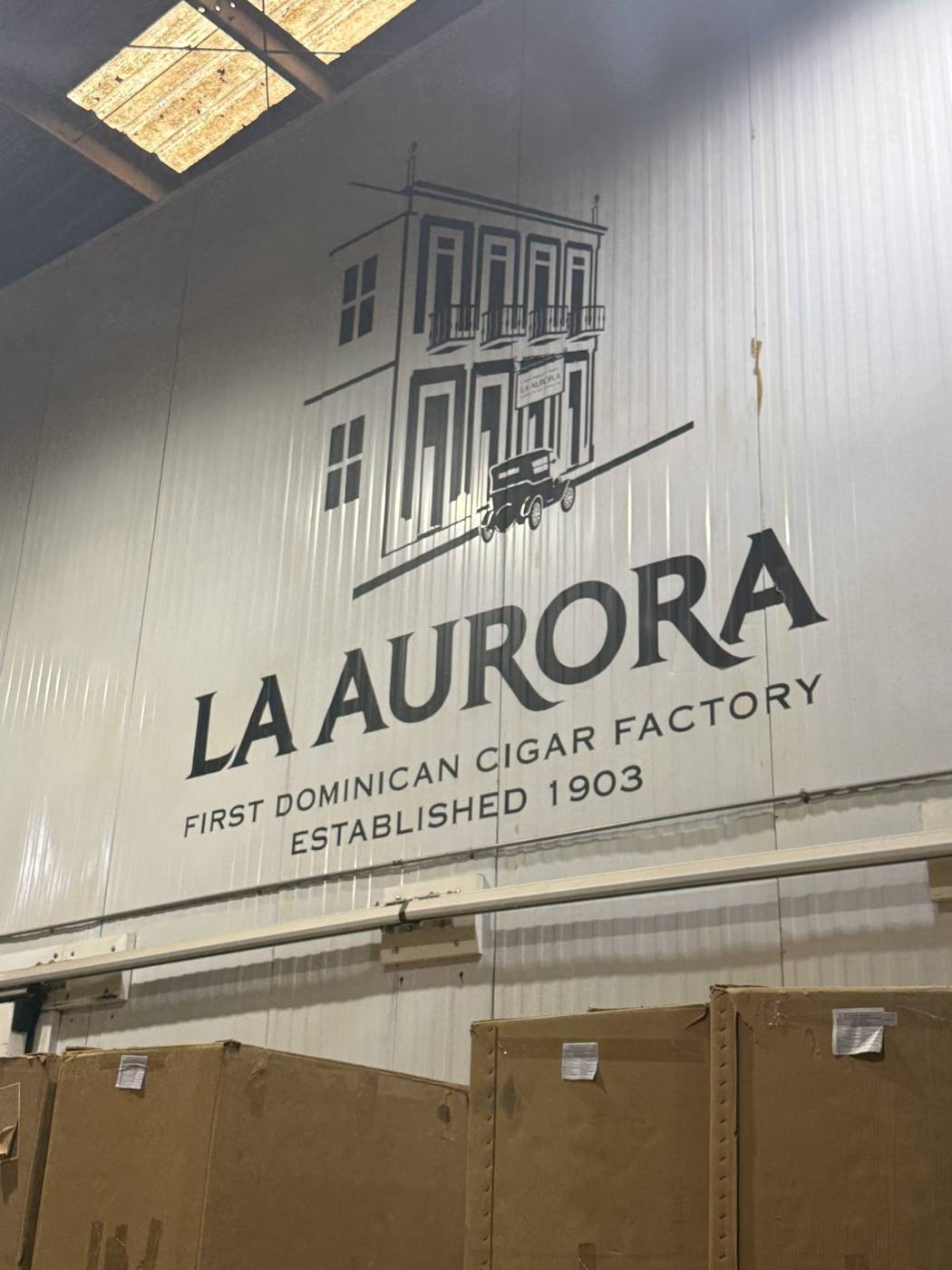 The La Aurora sign reading First Dominican Cigar Factory, Established 1903