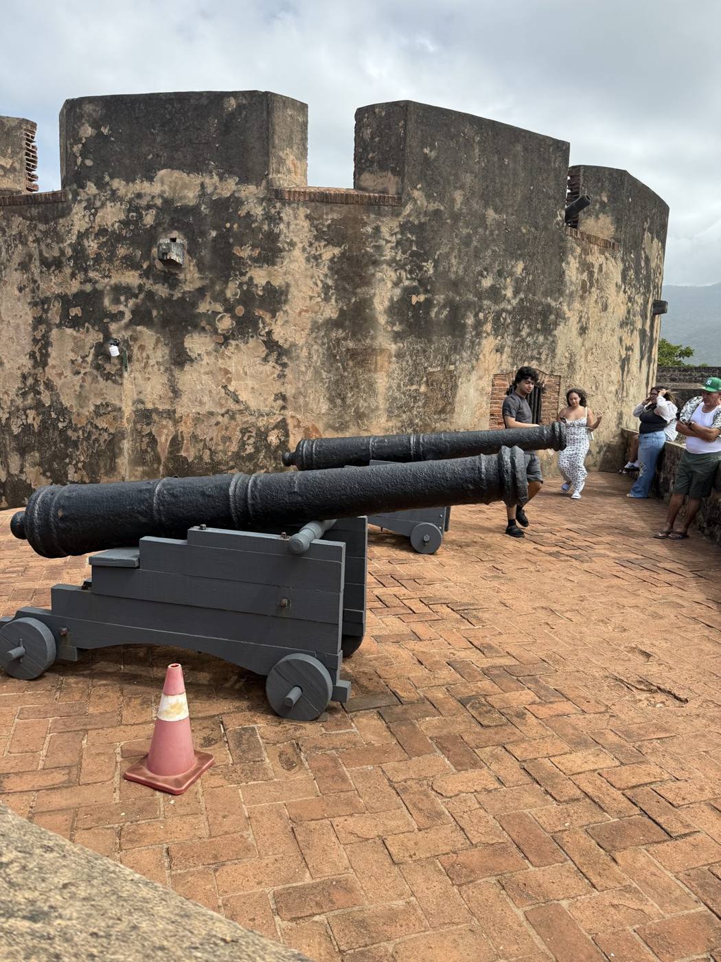 Old iron cannons on the brick terrace of the Fortaleza San Felipe in Puerto Plata