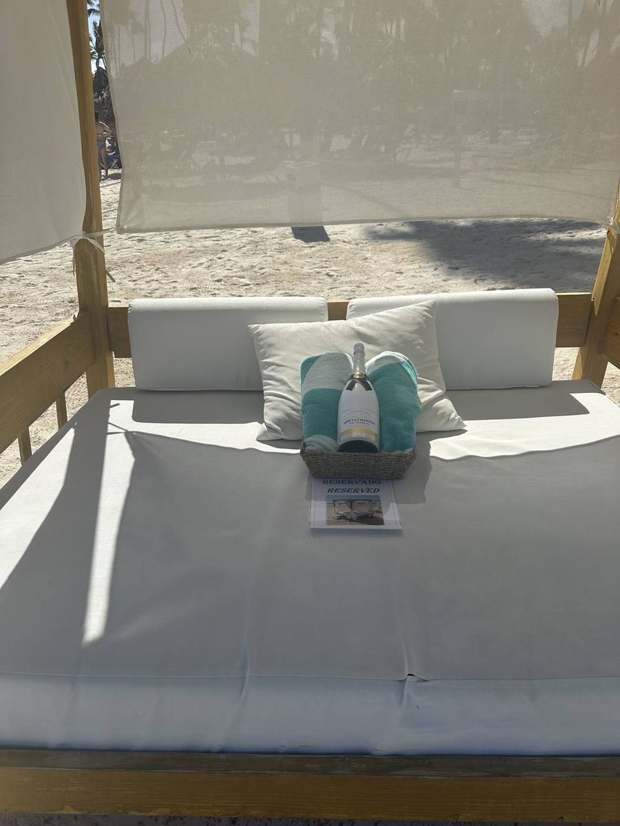 Beach daybed with towels under a canopy